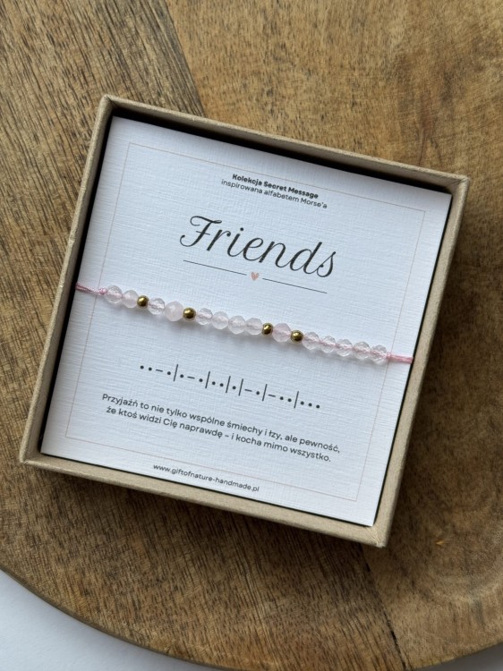 Zbliżenie na kartę produktową Lazuri z legendą alfabetu Morse'a i zakodowanym słowem Friends.
